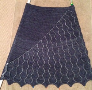 Bold Move is blocking!  I have broom and mop handles inserted up the sides to prevent creasing and spread the lace.  Elastic has not been inserted in the waistband yet.  Isn't it a pretty waist band, though? This skirt is going to be great.