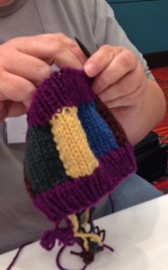 I am too busy to take photos during classes, so I can't show you all of the wonderful knitting produced.  This knitter was finishing her project as I packed up, so I got a shot.  She turned her in-the-round swatch into a headband/ear warmer.  Very clever and useful.  Good work!