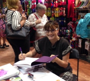 "Annetarsia Knits" was sold in three booths at Stitches East.  Here I am signing at Elegant Ewe, and at this signing they sold out of their stock!  Fortunately, Yarn Barn of Kansas still had books through Sunday, and I signed them there, as well.  I enjoy visiting with the knitters who are taking the book home, the time passes quickly.