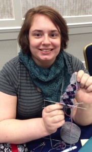 Rebecca, at the end of Argyle sock class, with her adorable mini-sock.  