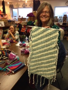 Here, Kelly is showing the project from the side without the yarn supplies.  There is no real "right" or "wrong" side with garter stitch, of course!  Both sides are lovely.