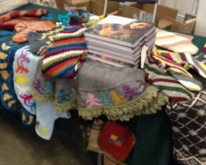 Setting up the author's table at Rhinebeck.  Within hours, every book Merritt Bookstore had ordered was sold, and the table wasn't organized anymore!  But knitter's loved checking out the projects from "Annetarsia Knits"