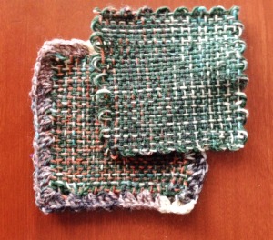 This is doubled sock yarn - one solid dark green, and the other is varigated.  I did a double-crochet edging on the bottom one, using a single strand of the varigated yarn.