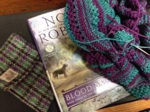 It turns out that the book I am currently reading, my cell phone case, and my knitting project all match.  It has to be coincidental ( I didn't even pick the colors for this project, Tina Newton did it for me).  Right?