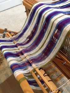 Warp wound on the back beam, ready to thread the heddles.  It took ALL DAY to get to this point.  That is 480 pieces of sticky string, wrangled into submission!  Couldn't have done it without Tracy and Lisa's encouragement and help. 