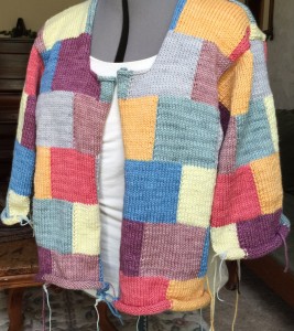 Before blocking, the poor sweater doesn't have any shape.  It looks better on the mannequin than it did on me, but not by much!