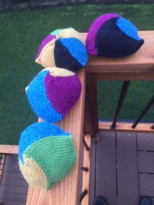 4 knitted knockers, Annetarsia ITR, with various Skacel yarns.  Size 4 dpns used to knit them, stuffed with poly fiberfill.