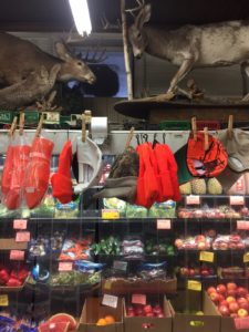 Taxidermy, hats, and produce, all on one aisle. Convenient!