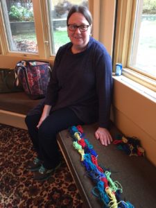 Jill with her butterflies laid out to knit in order. Fun!