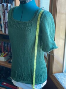 unblocked sweater body, 3 inches longer than the pattern calls for, to allow for expected shrinkage.